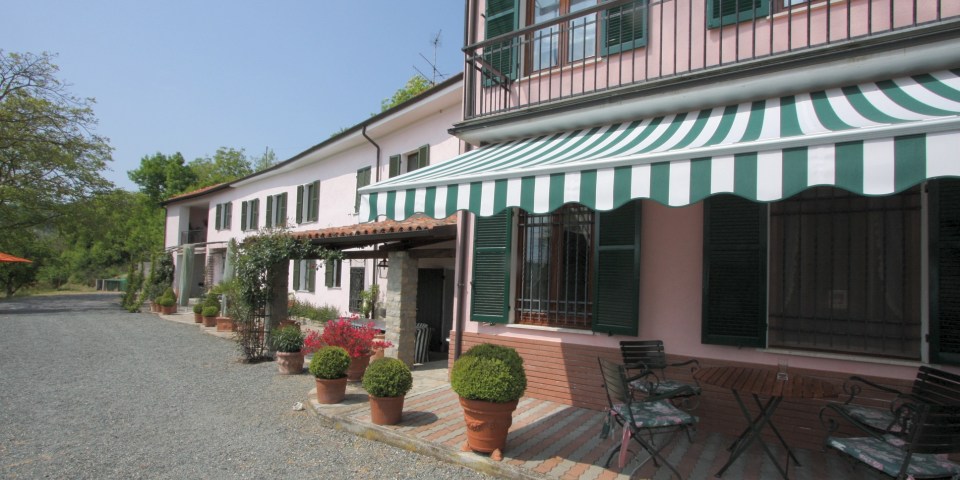 
			The south-facing country villa and the adjoining guest house
			