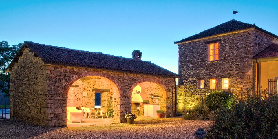 
			The Portico with the summer kitchen in the evening
			