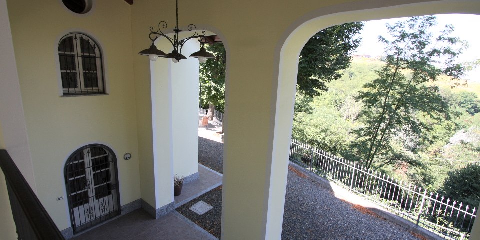 
			The portico attached to the house
			